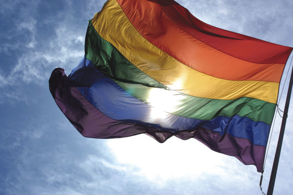Rainbow_flag_and_blue_skies